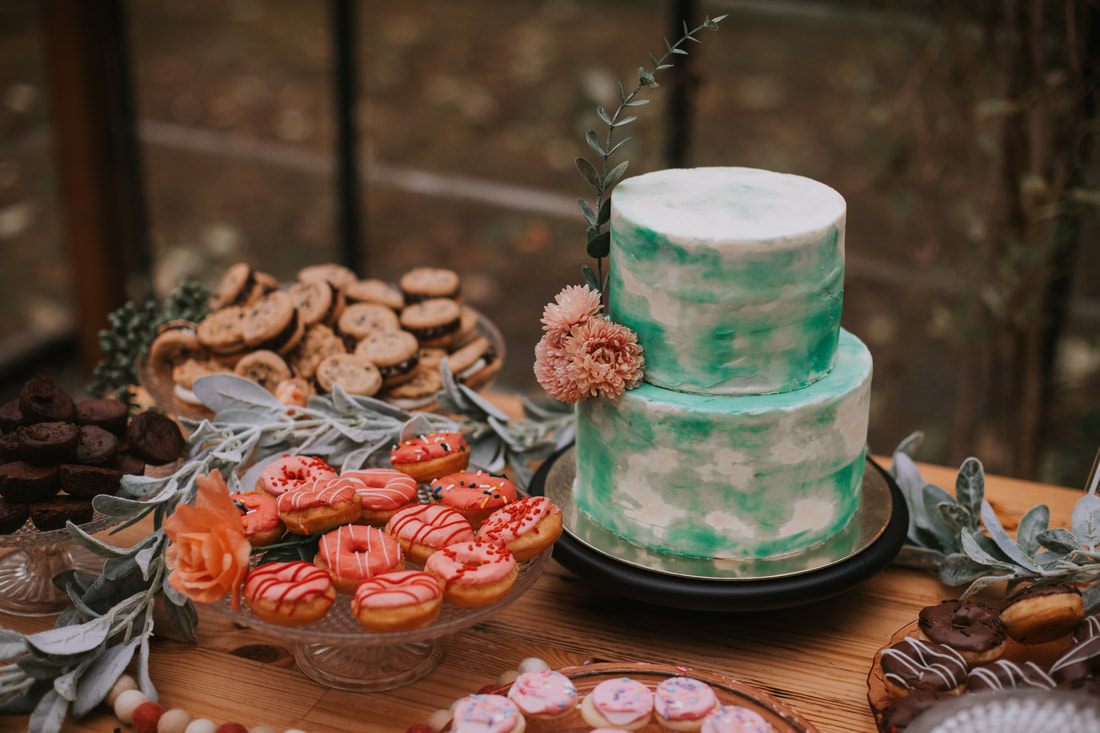 Vintage teacups and saucers set on the tea party wedding tablescape, later in the celebration