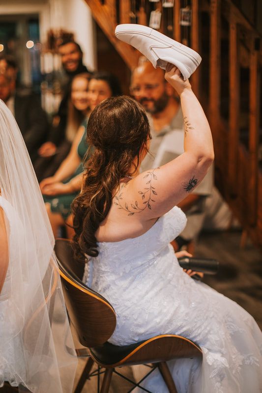The newlyweds dancing together during the indoor reception, later in the celebration