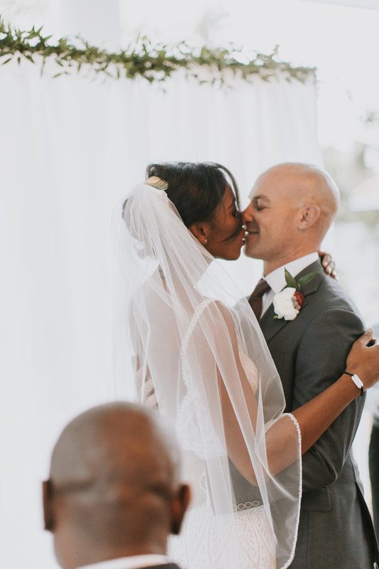 The couple exchanging vows during their intimate elopement ceremony on Isle of Palms, from another moment of the weekend