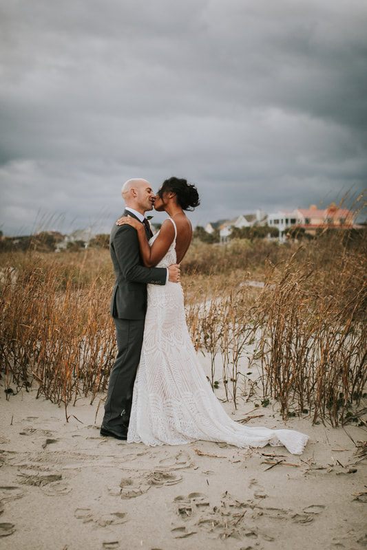 The couple sharing a quiet moment together against the bright Charleston sky, from another moment of the weekend