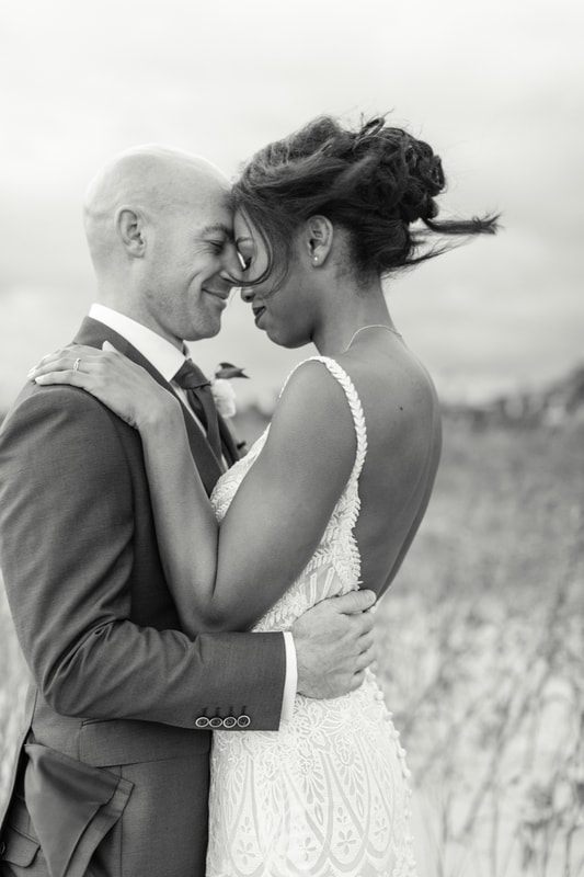 The couple exchanging vows during their intimate elopement ceremony on Isle of Palms, one more frame from the day