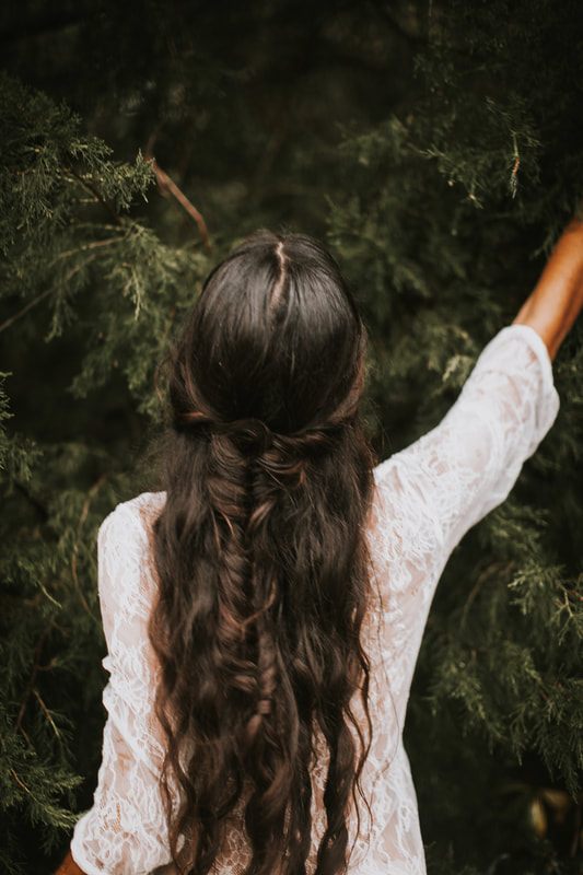 Anya posed among greenery in a romantic bridal styled shoot