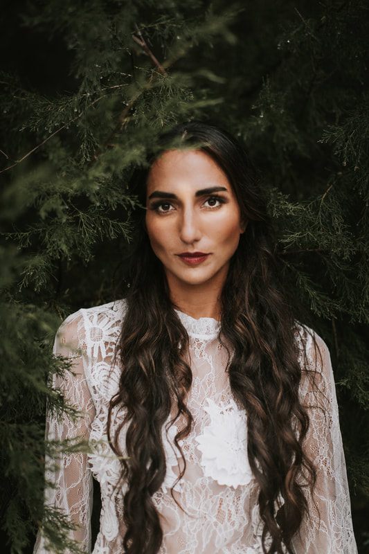 Dreamy bridal portrait with soft focus forest background