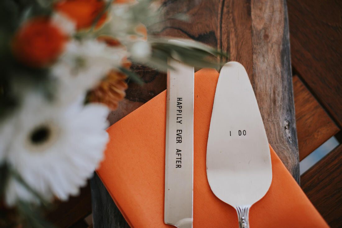 Detail shot of the bride's bright orange and lime green wedding details.