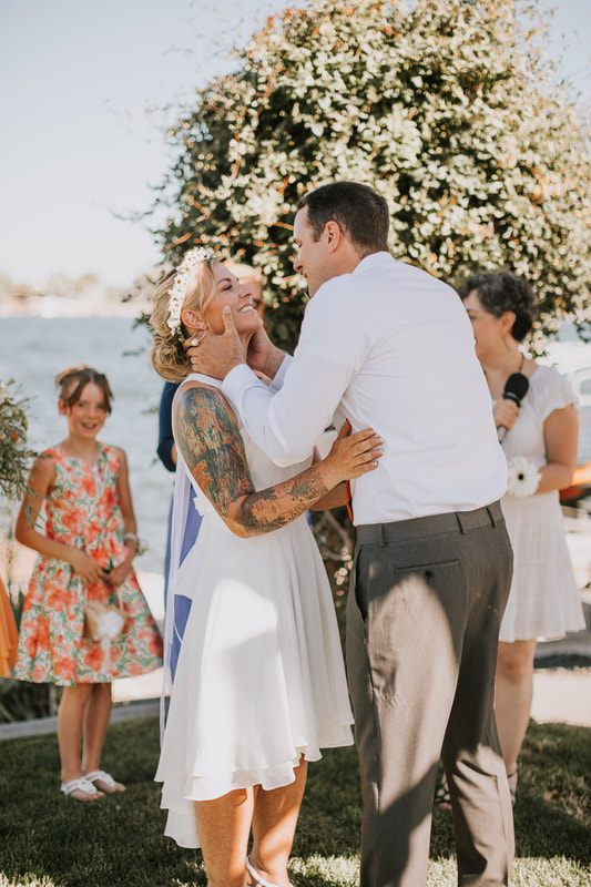 Wide shot of the intimate backyard ceremony on the shores of Moses Lake.