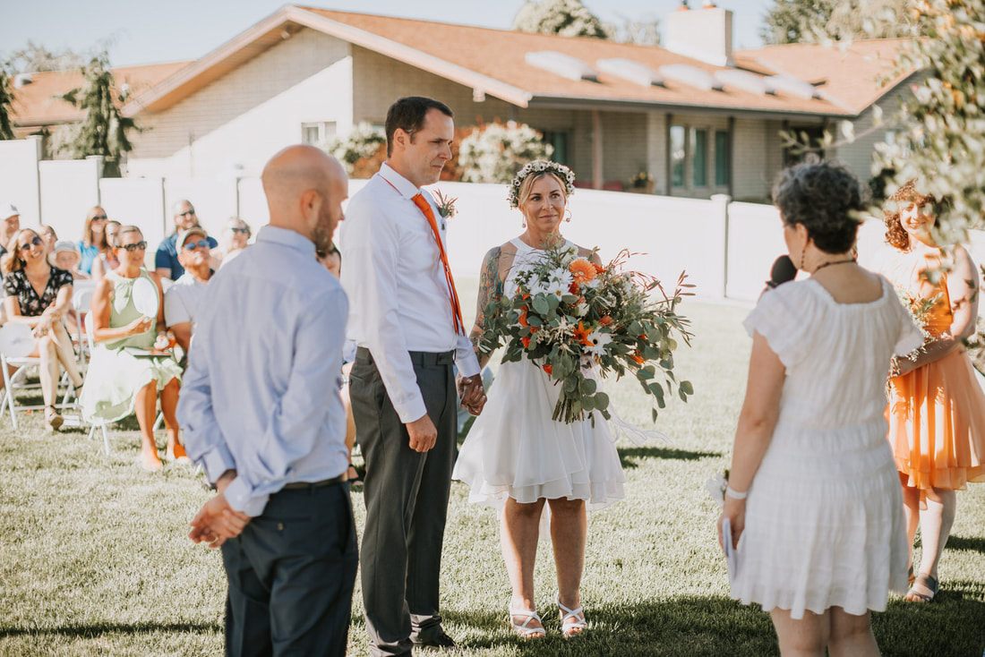Candid portrait of family and friends celebrating Tomi and Daniel's wedding day.