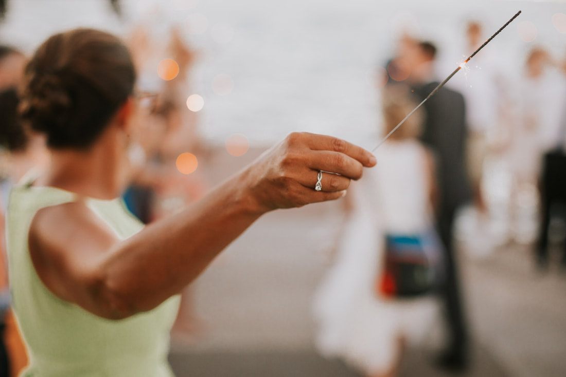 Tomi and Daniel dancing together at their summer micro wedding celebration.