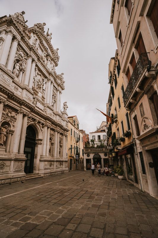 Aperol Spritz on a table with Venice canal views