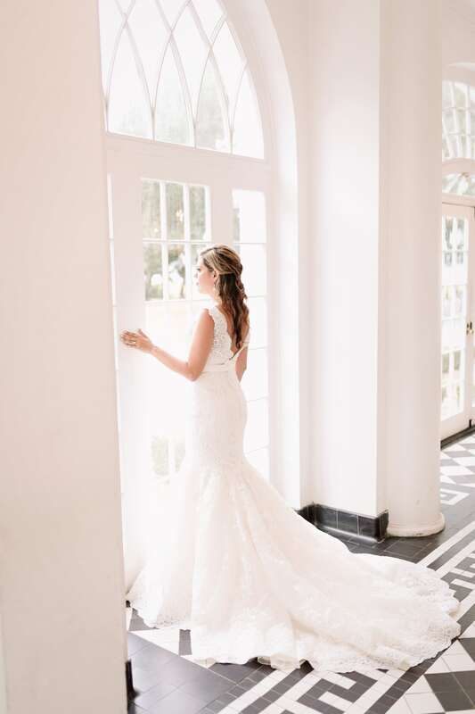 Lauren twirling in her wedding dress on the plantation lawn in Charleston, SC