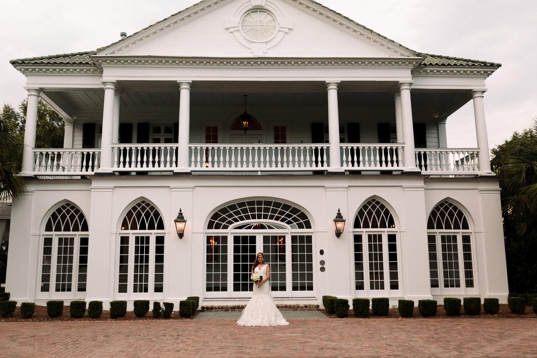 Lauren standing on the historic plantation steps in her bridal gown