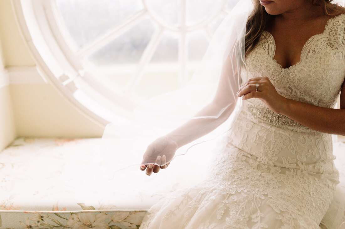 Golden hour bridal portrait of Lauren beneath the plantation's grand oak trees