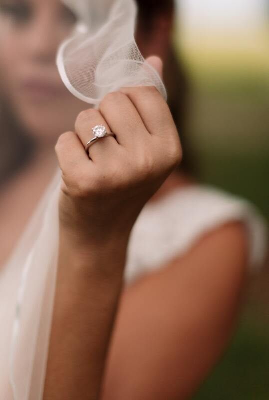 Lauren laughing candidly during her bridal portrait session in Charleston