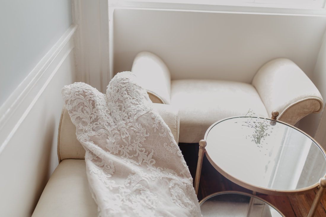 Three brides walking arm in arm through Gadsden House