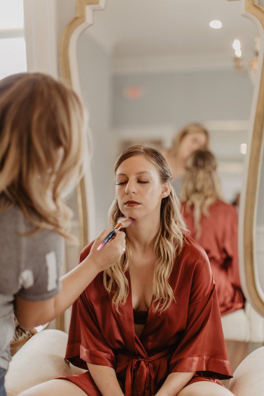 Champagne toast among three brides at the bridal soiree