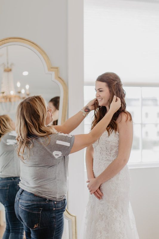 Group of brides laughing together in the Gadsden House parlor