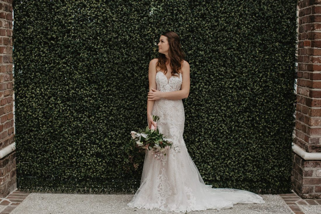 Candid laugh between brides mid hair-and-makeup session