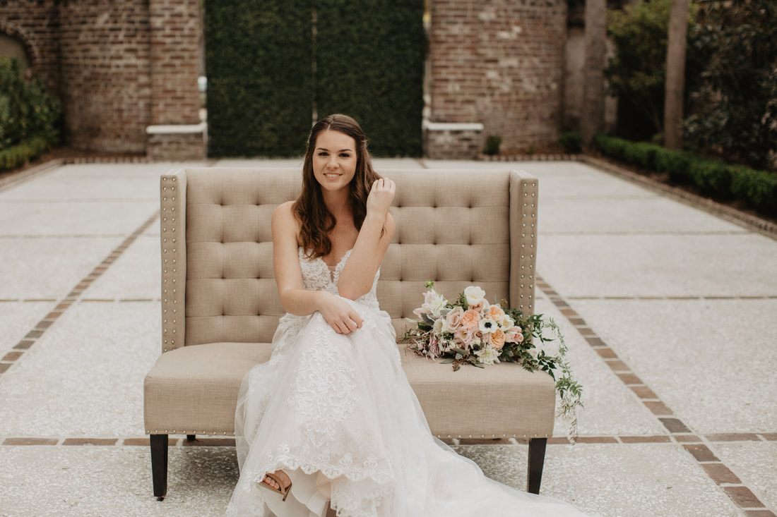 Close-up of a bride's hands holding her bouquet at Gadsden House