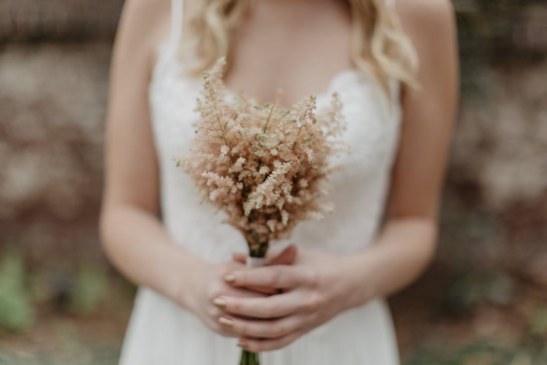 Bride peeking through a doorway at historic Gadsden House