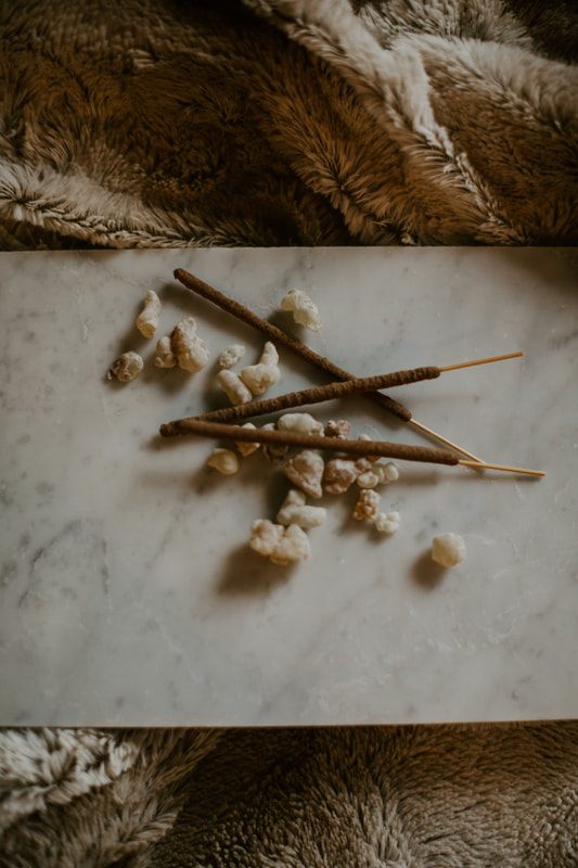 Styled flat-lay of Leftover Hippies incense with dried botanicals