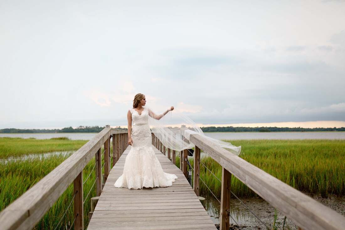 Detail shot of Lauren's bridal gown and bouquet at the Lowndes Grove Plantation