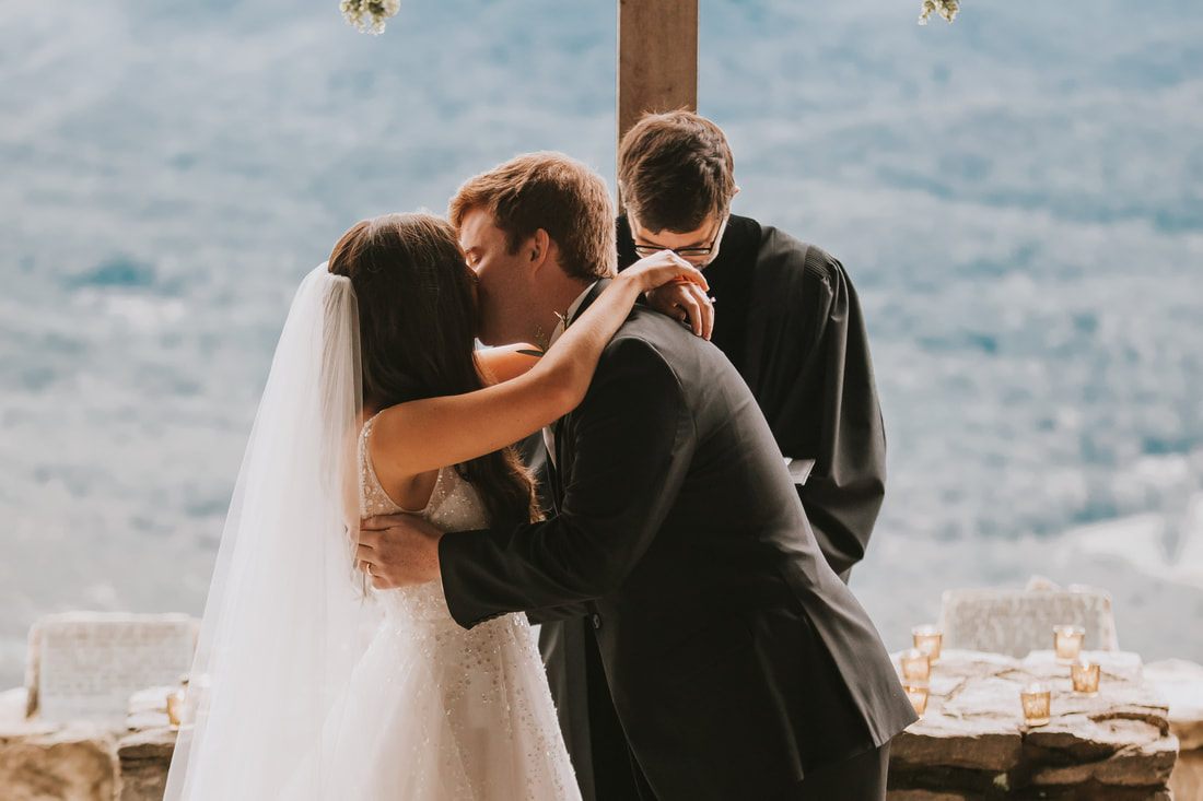 Cassandra and Charlie exchange vows at Pretty Place Chapel in the Blue Ridge Mountains.