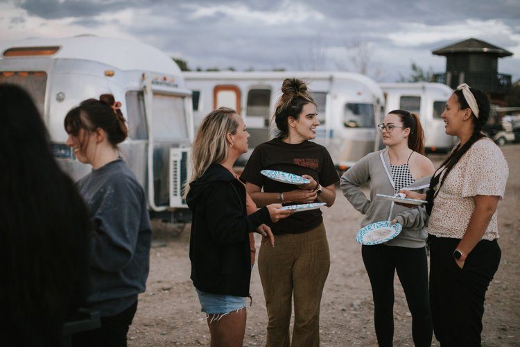 Women gathered around the fire in the Utah desert