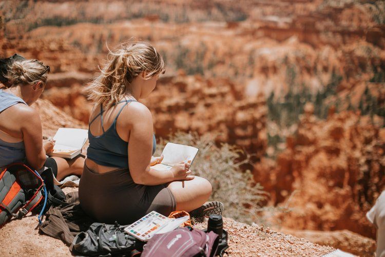 Women gathered around the fire in the Utah desert
