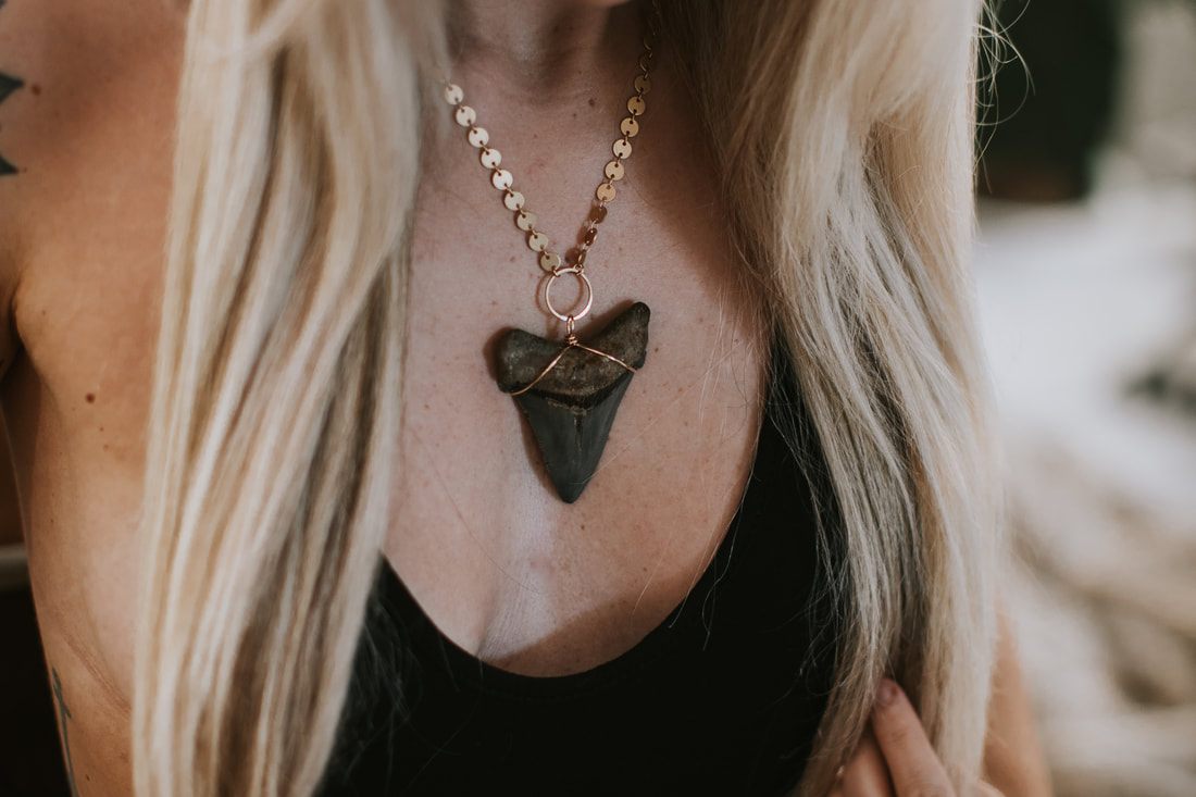 Samantha wearing DeeRuel jewelry against a soft studio backdrop