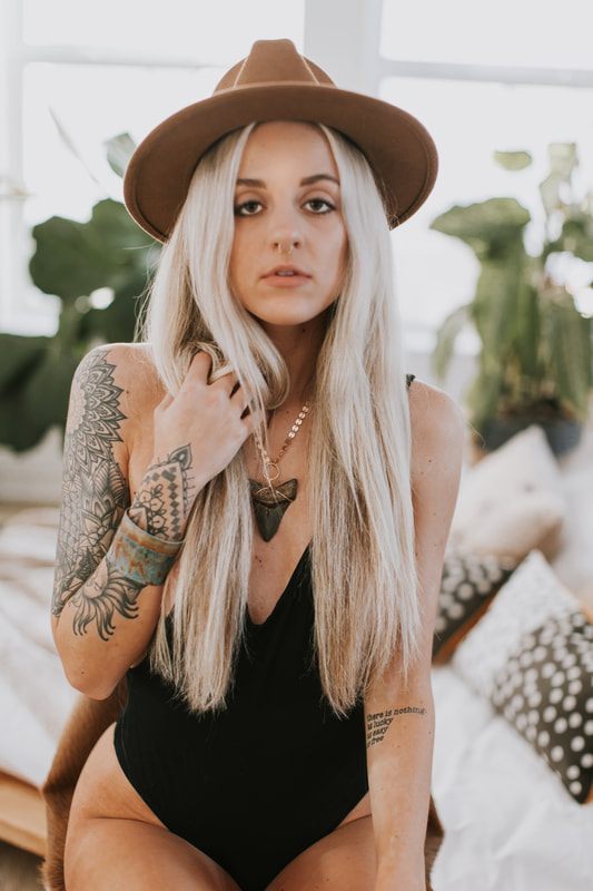 Detail shot of handmade DeeRuel jewelry worn by model Samantha