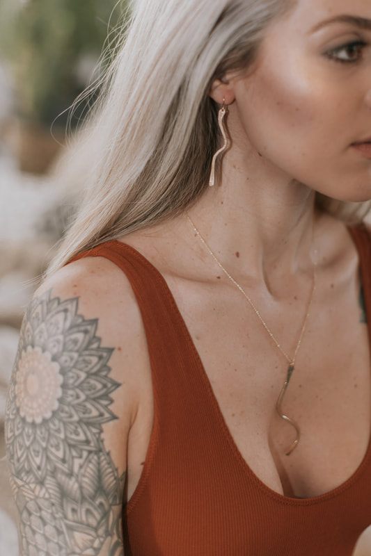 Styled commercial portrait of Samantha for the DeeRuel jewelry brand