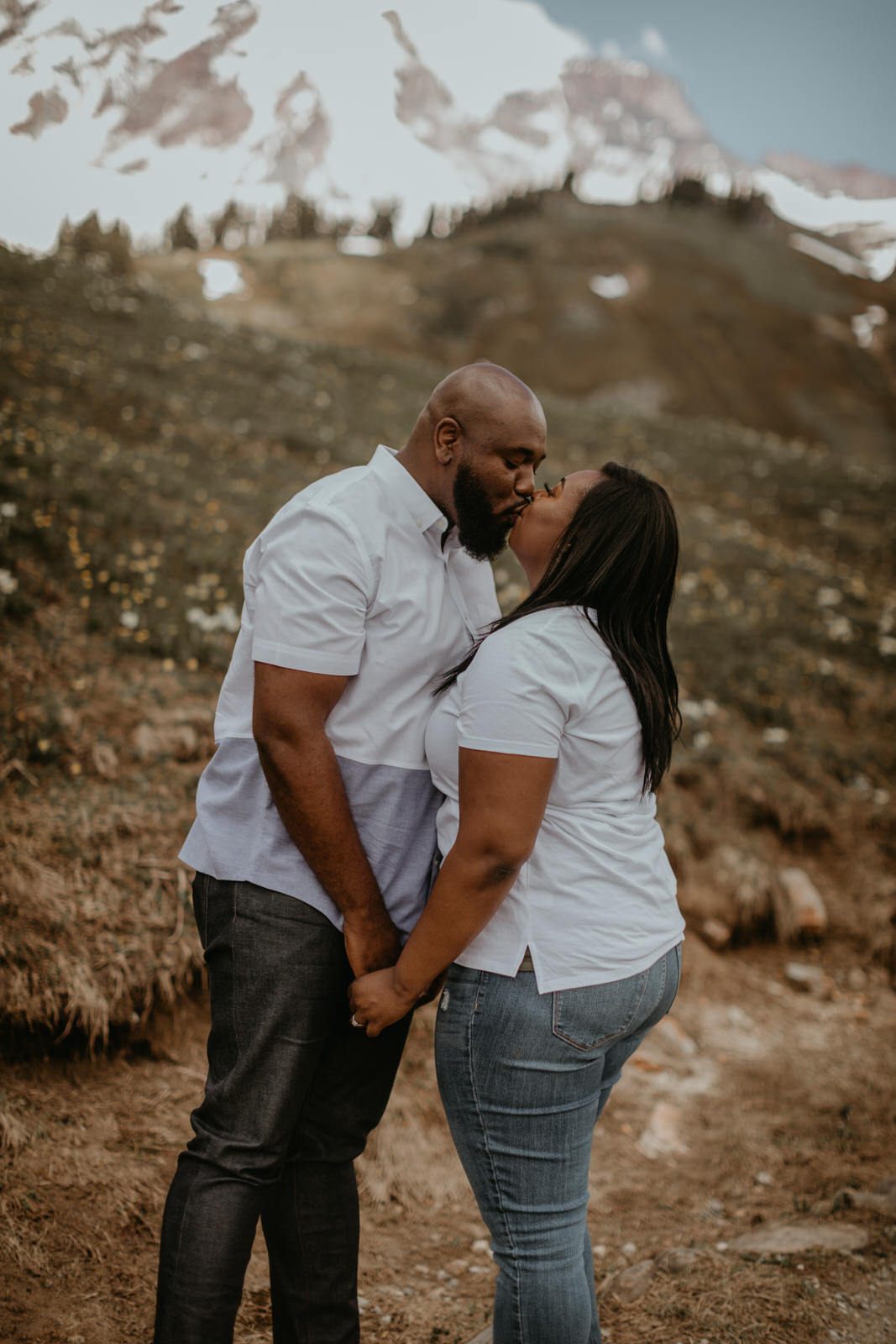 Engagement portrait in a wildflower meadow near Mt. Rainier