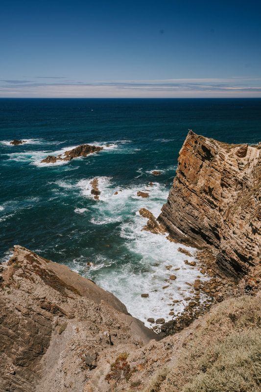 Sweeping view of the Portuguese coastline from a cliffside farm