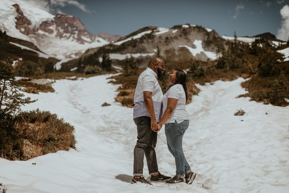 Tyeisha and Adam embracing during their engagement session at Mt. Rainier