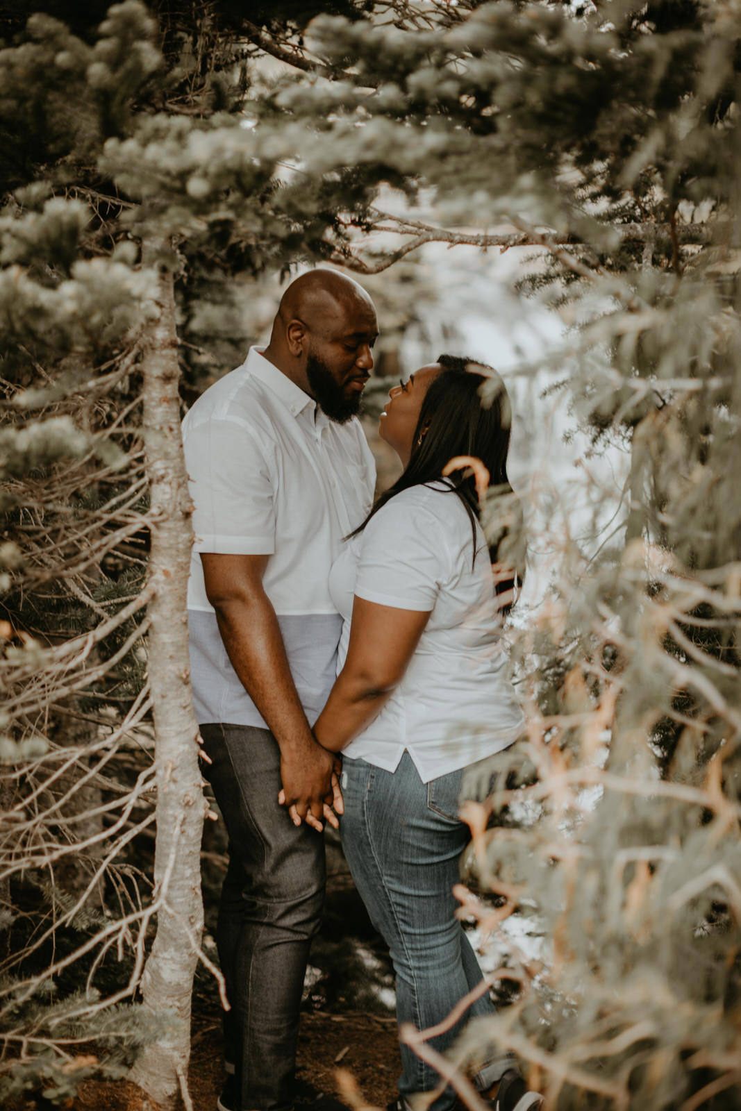 Close-up portrait of the couple laughing together on the mountainside
