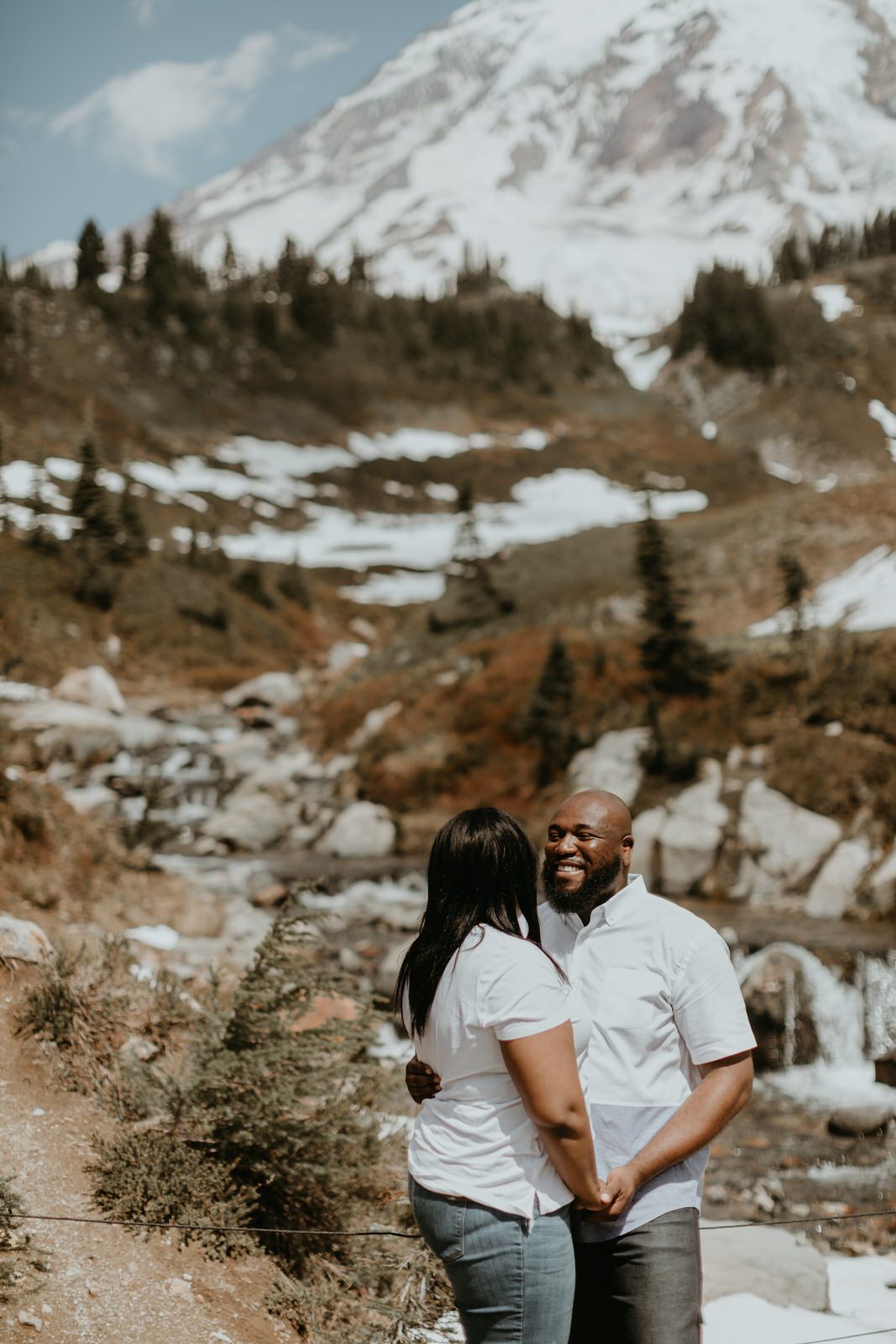 Golden light portrait of the engaged couple at Mt. Rainier National Park