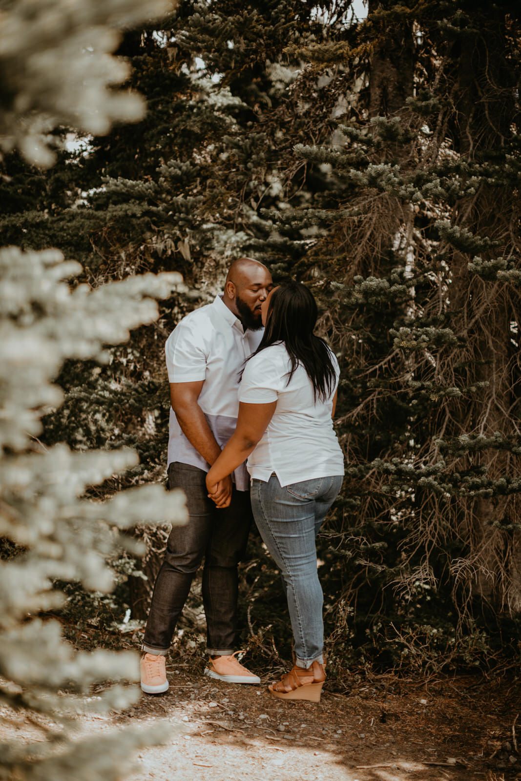 Tyeisha and Adam sharing a quiet moment against the Mt. Rainier landscape