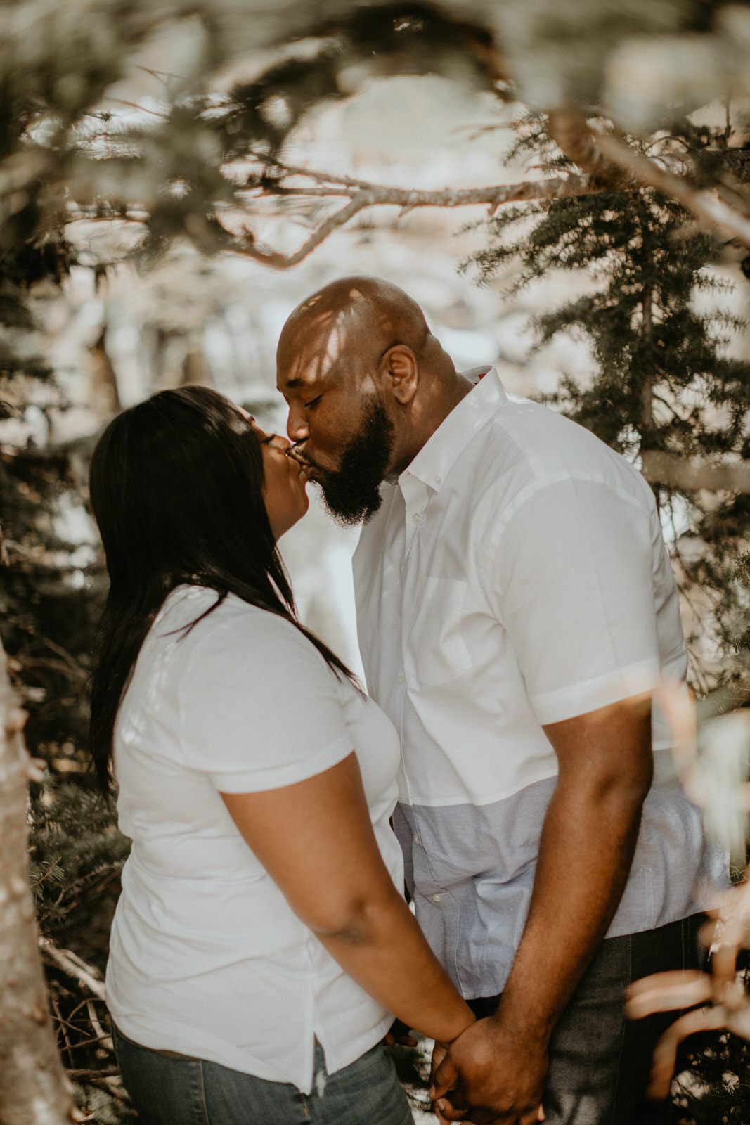 Couple walking along a mountain trail during their PNW engagement session