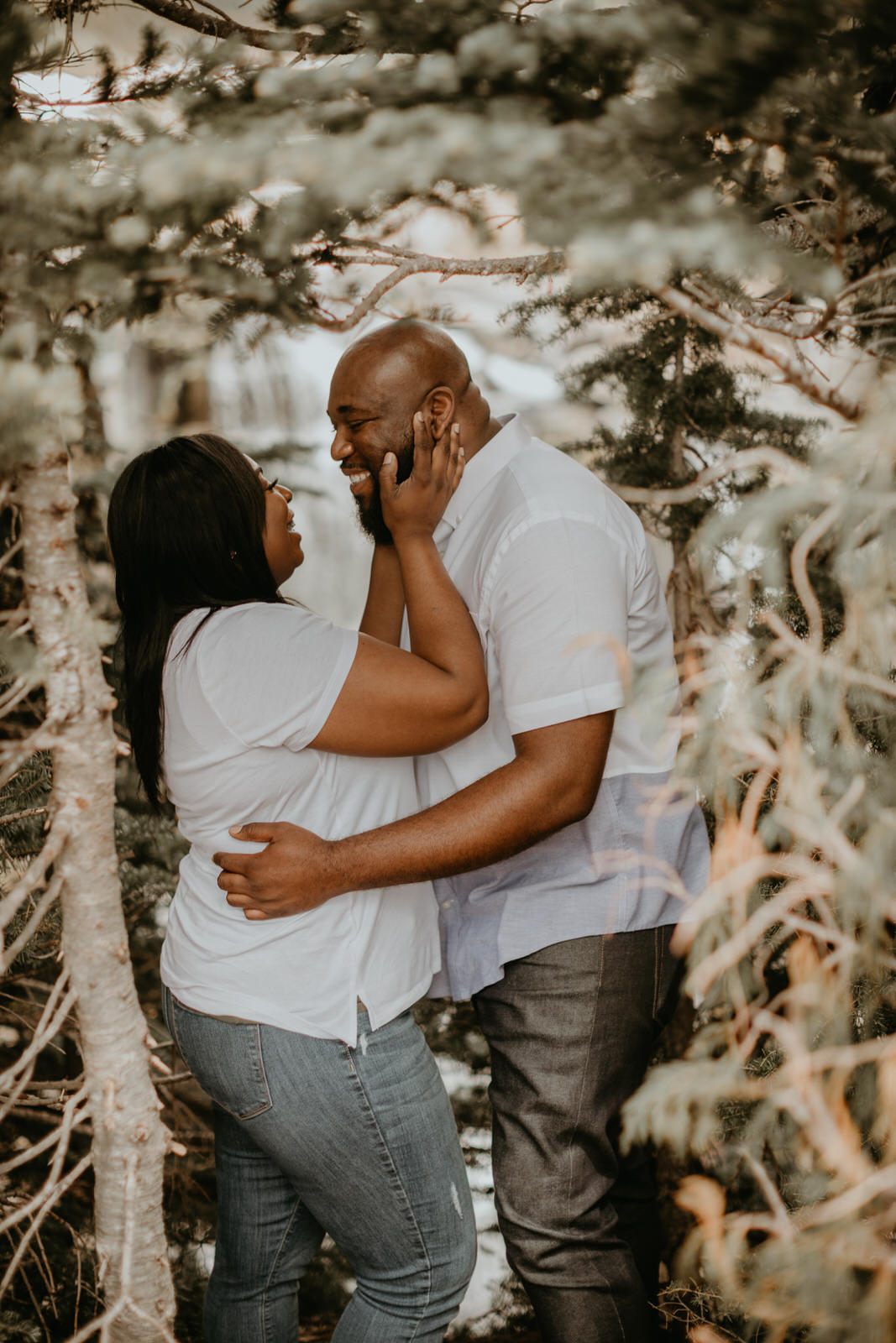 Tyeisha and Adam embracing during their engagement session at Mt. Rainier