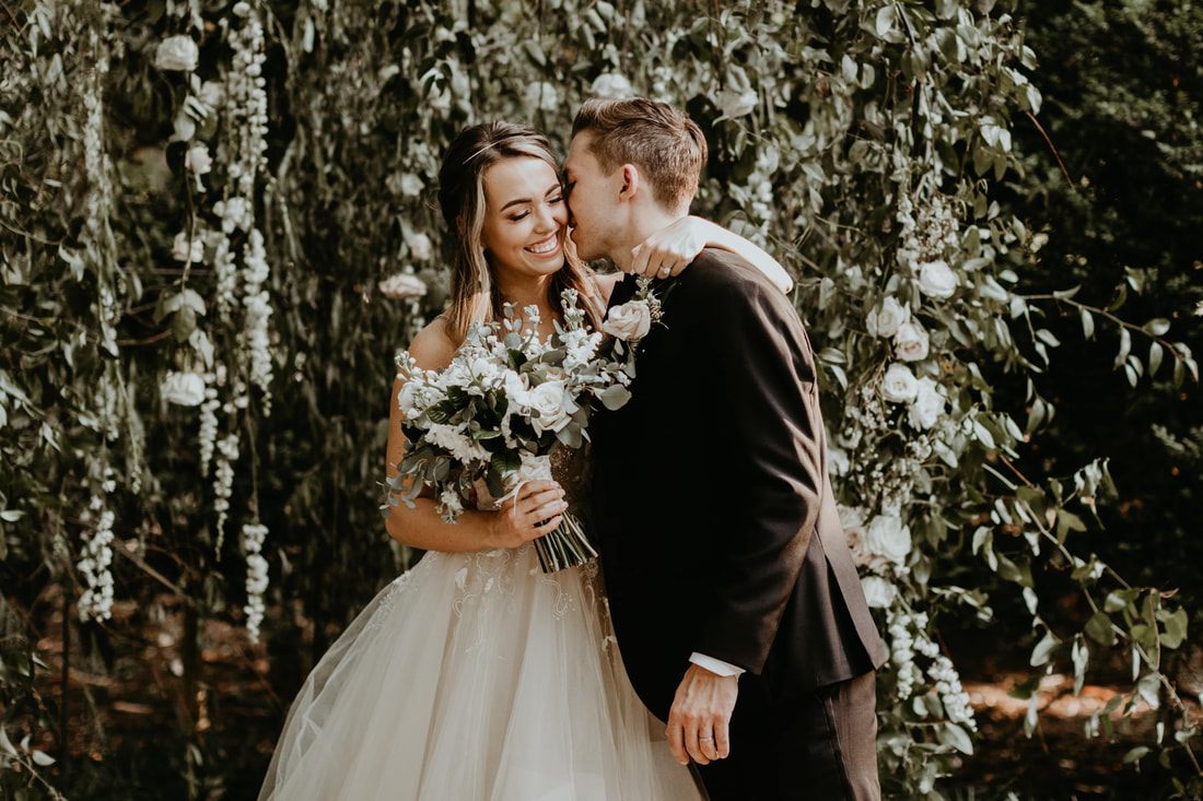 Chase and Mitch exchanging vows at their outdoor Nashville ceremony