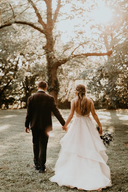 Newlyweds walking away from the ceremony arm in arm