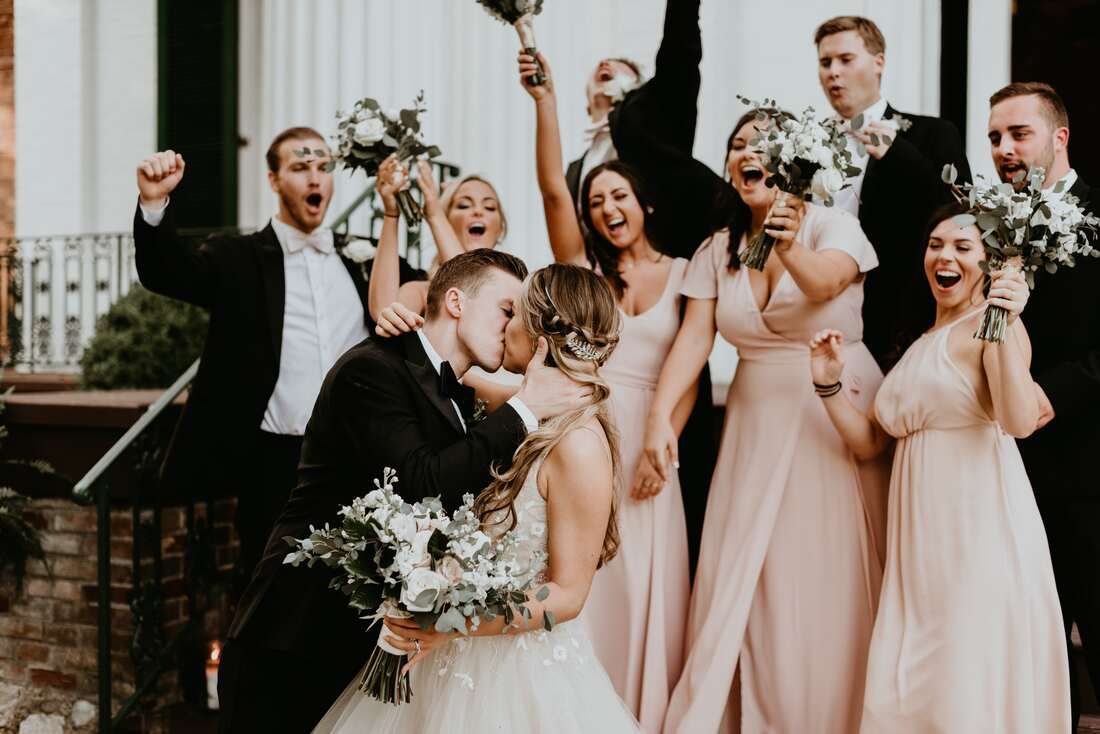 Candid portrait of the groom laughing with his groomsmen