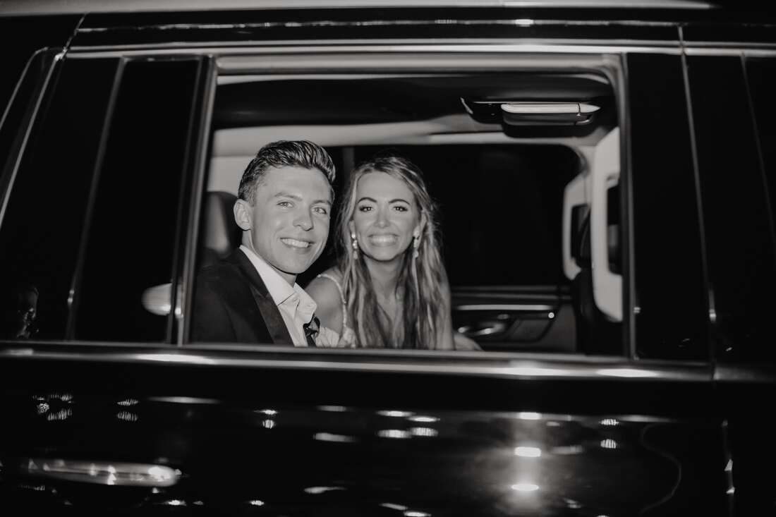 Final portrait of the newlyweds walking into the evening