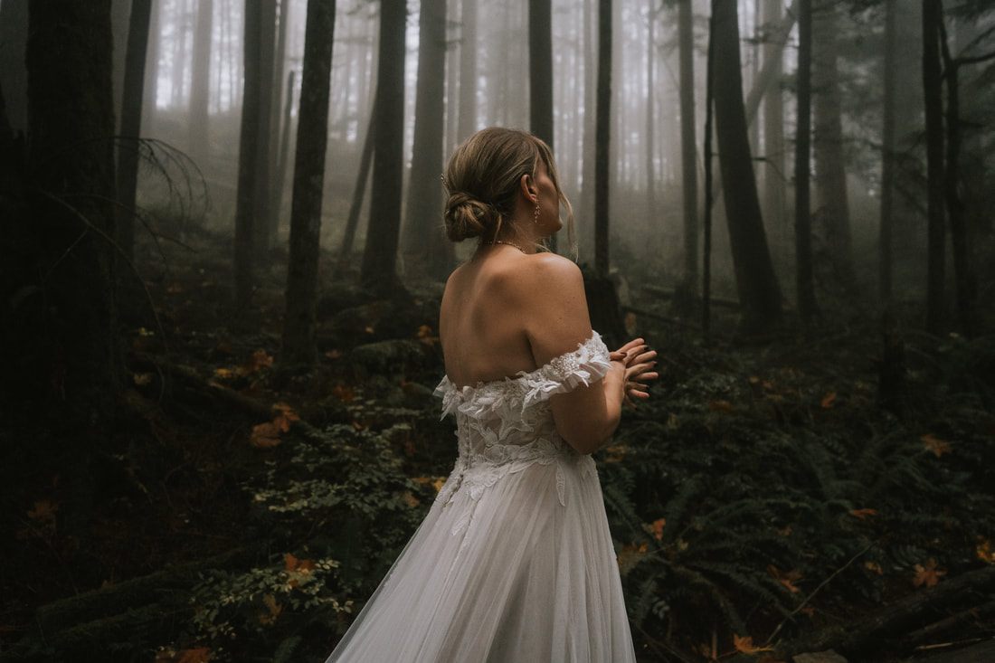 Tiana and Malik dancing together outside That PNW Cabin after their ceremony.