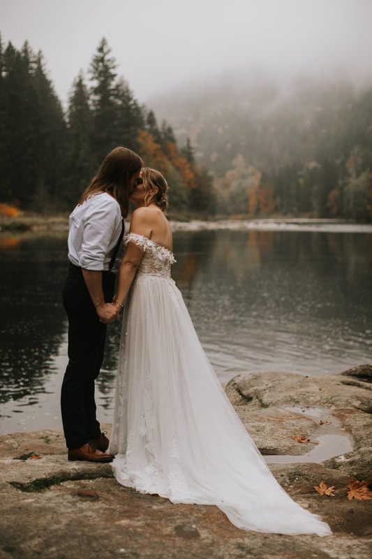 The couple exchanging vows on the Heybrook Lookout Trail in thick fog.