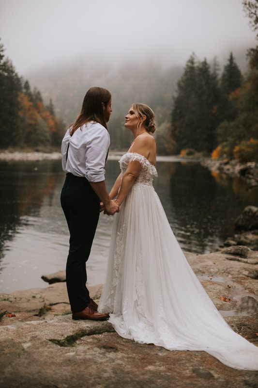 Tiana and Malik dancing together outside That PNW Cabin after their ceremony.