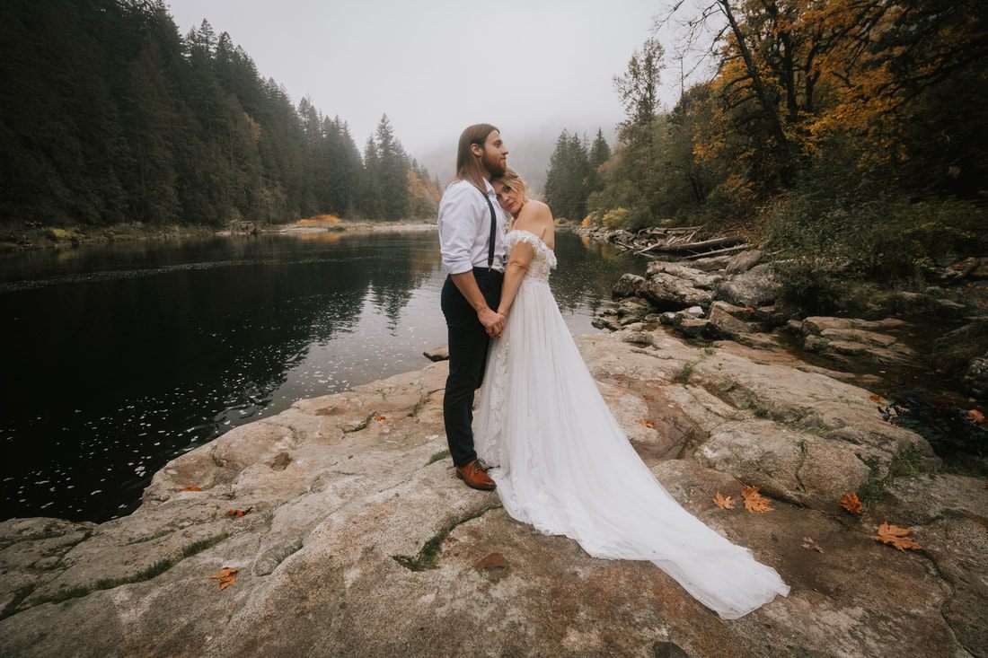 Tiana and Malik sharing a quiet moment in the foggy PNW forest.