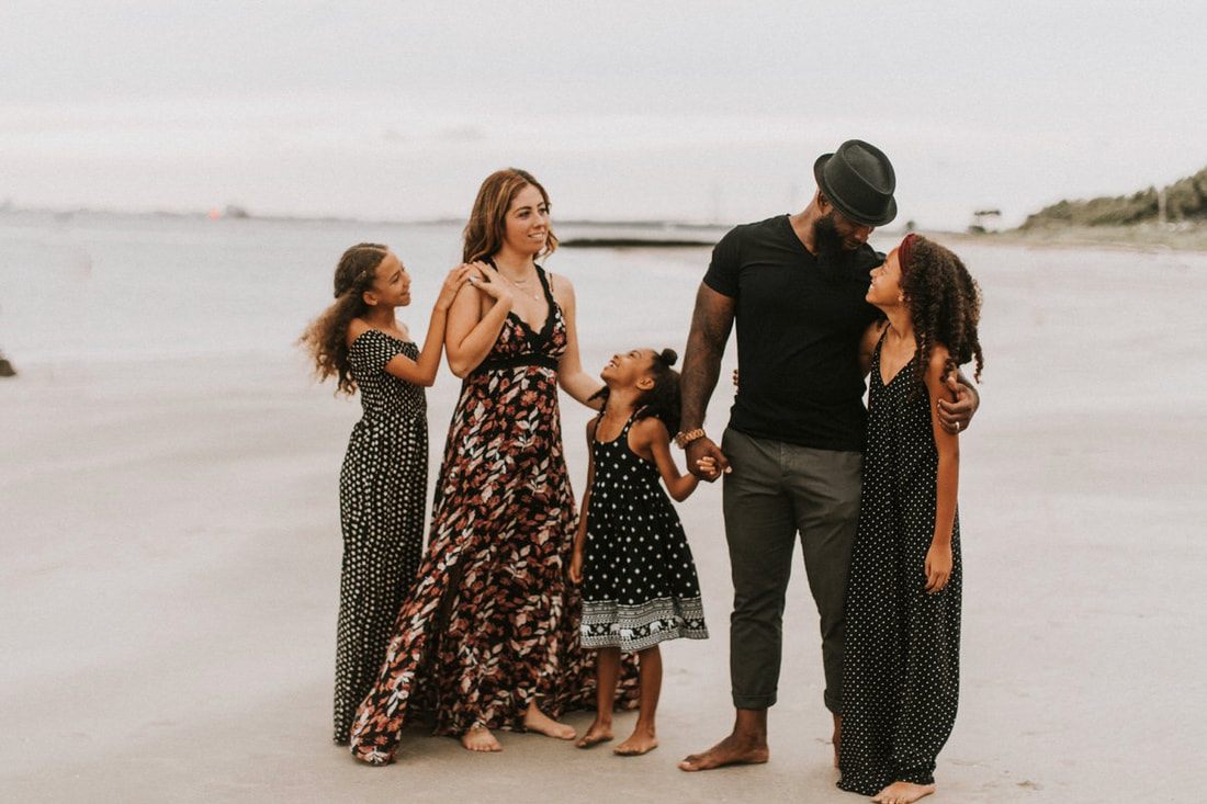 The Mickle family walking together on Sullivan's Island near Charleston, SC