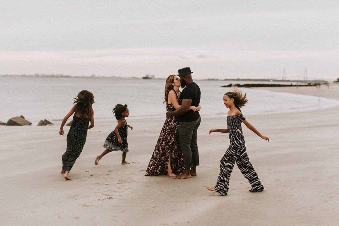 Nicole Mickle laughing with her daughters on the Charleston shoreline