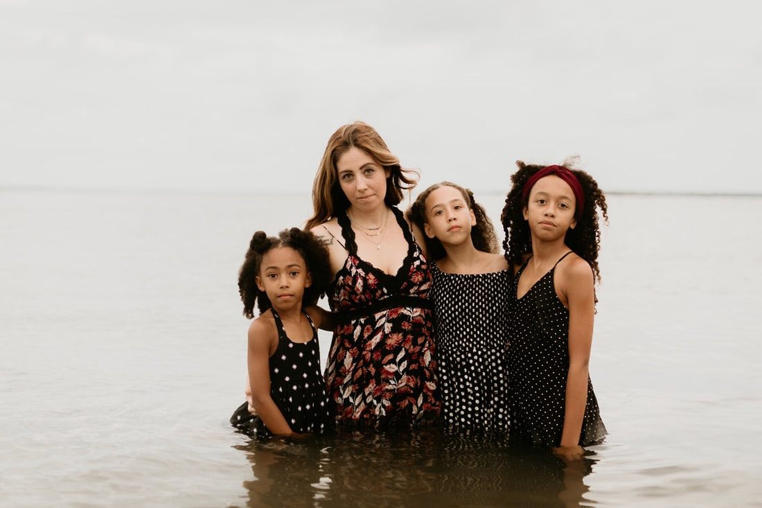 The Mickle family gathered together for a relaxed portrait on the coast