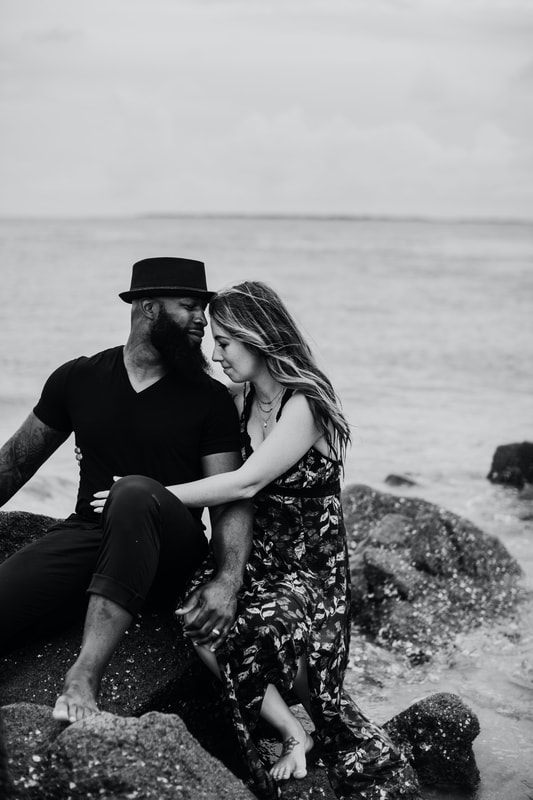Daughters playing in the sand during a Charleston family photo session